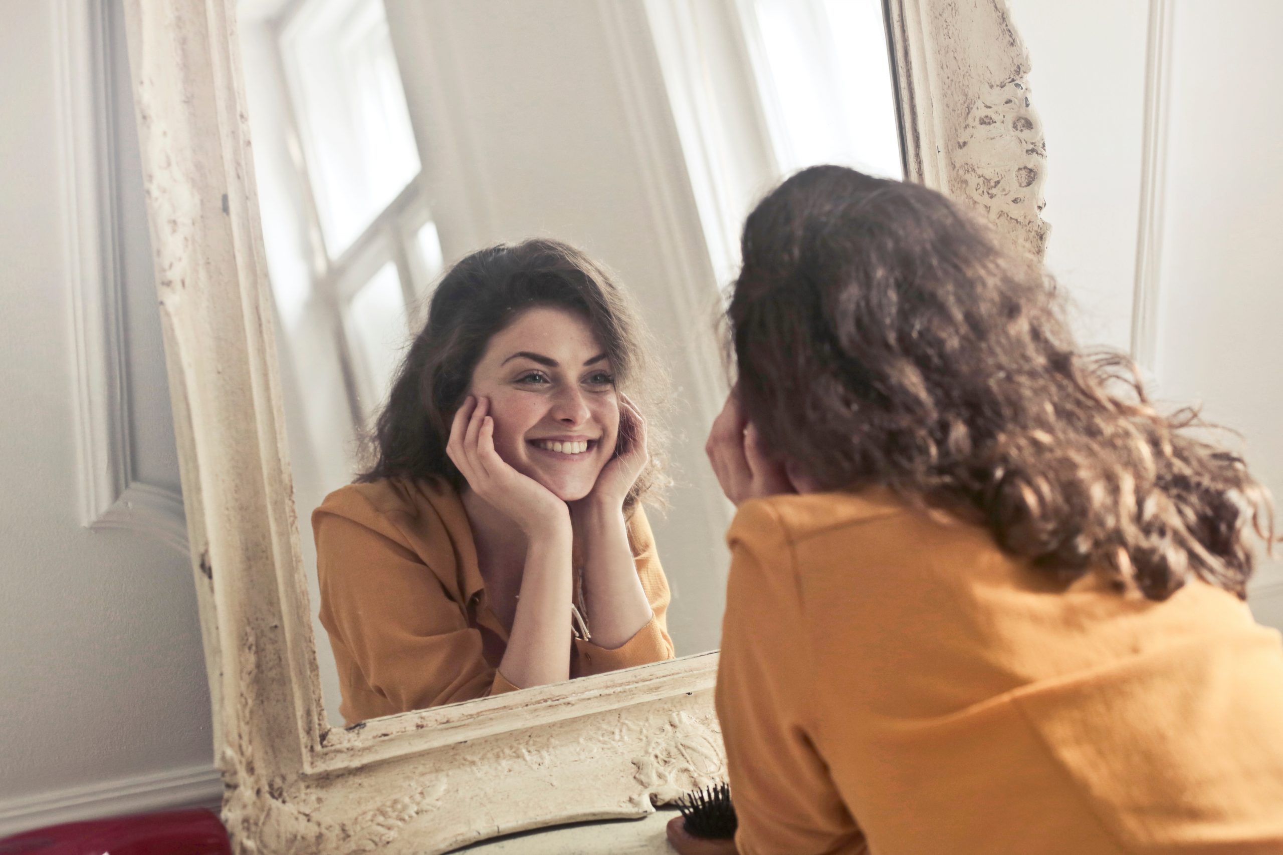 Canva - Photo of Woman Looking at the Mirror